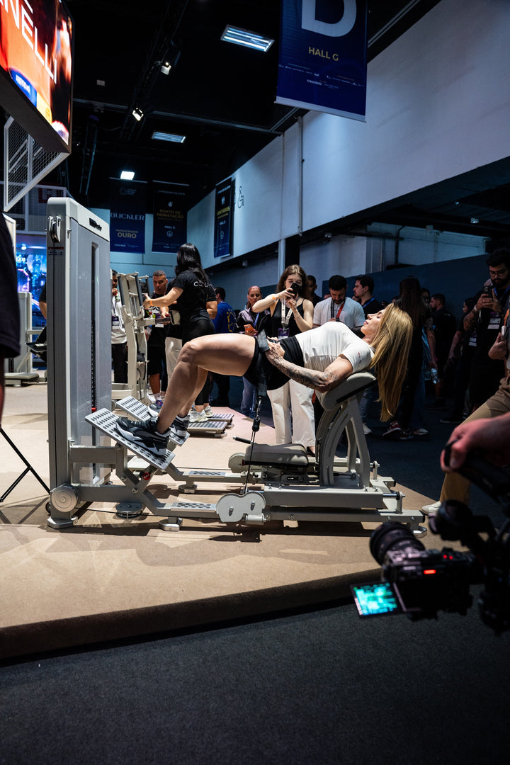 Athlete using the Gluteleader Buttocks Bridge GL-1001 in an exhibition gym