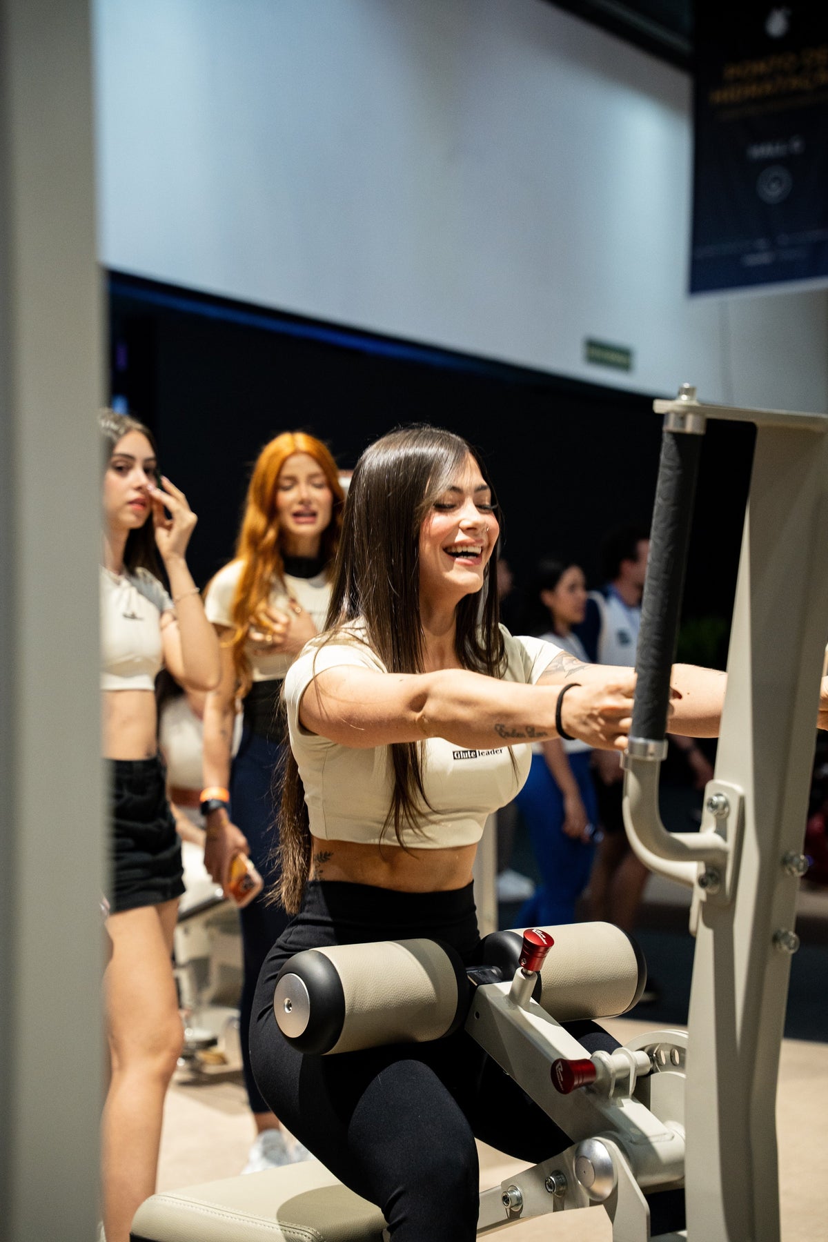 Athlete gripping the support handles on the Gluteleader Standing Hip Thrust GL-1004